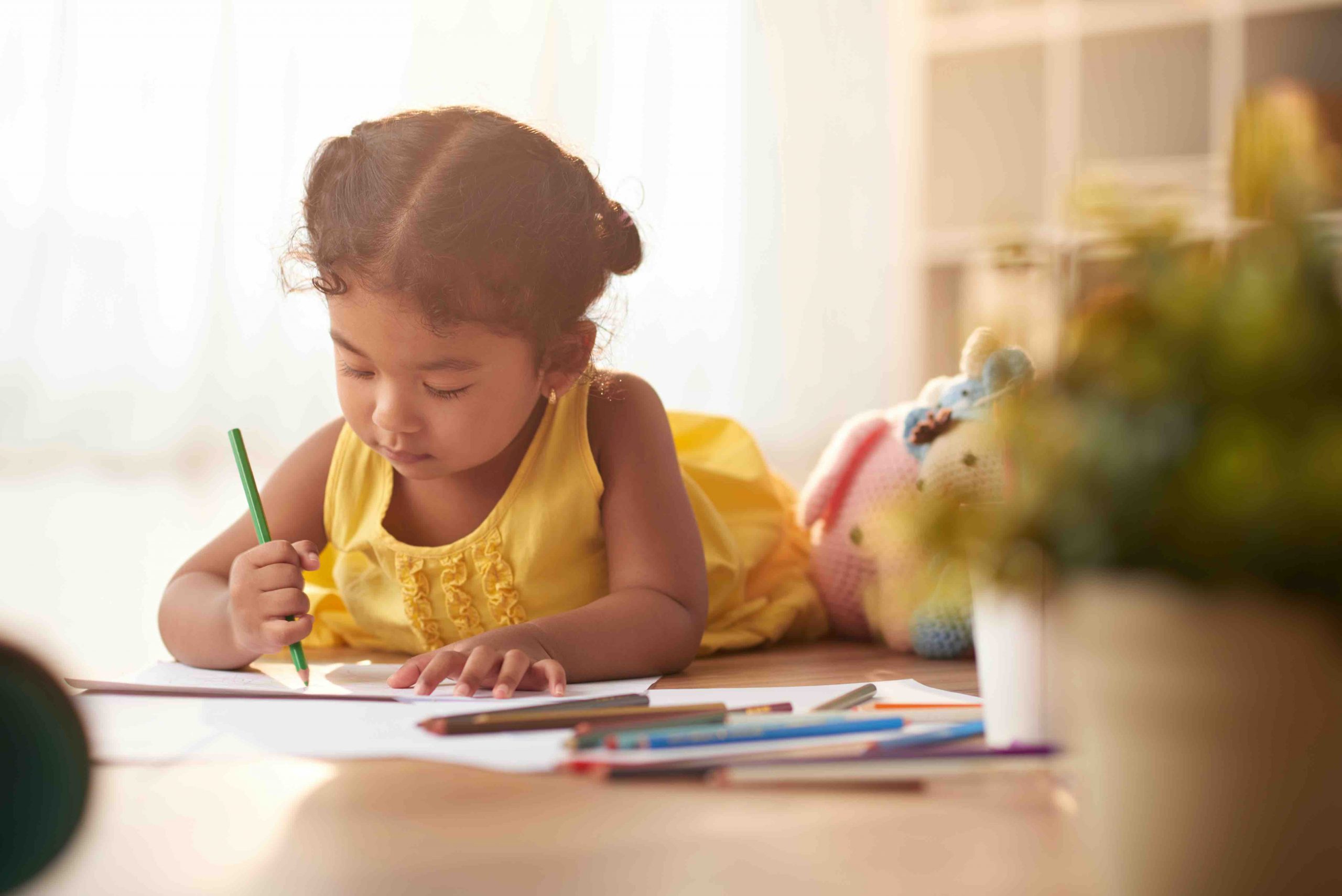 little-girl-focused-drawing-scaled
